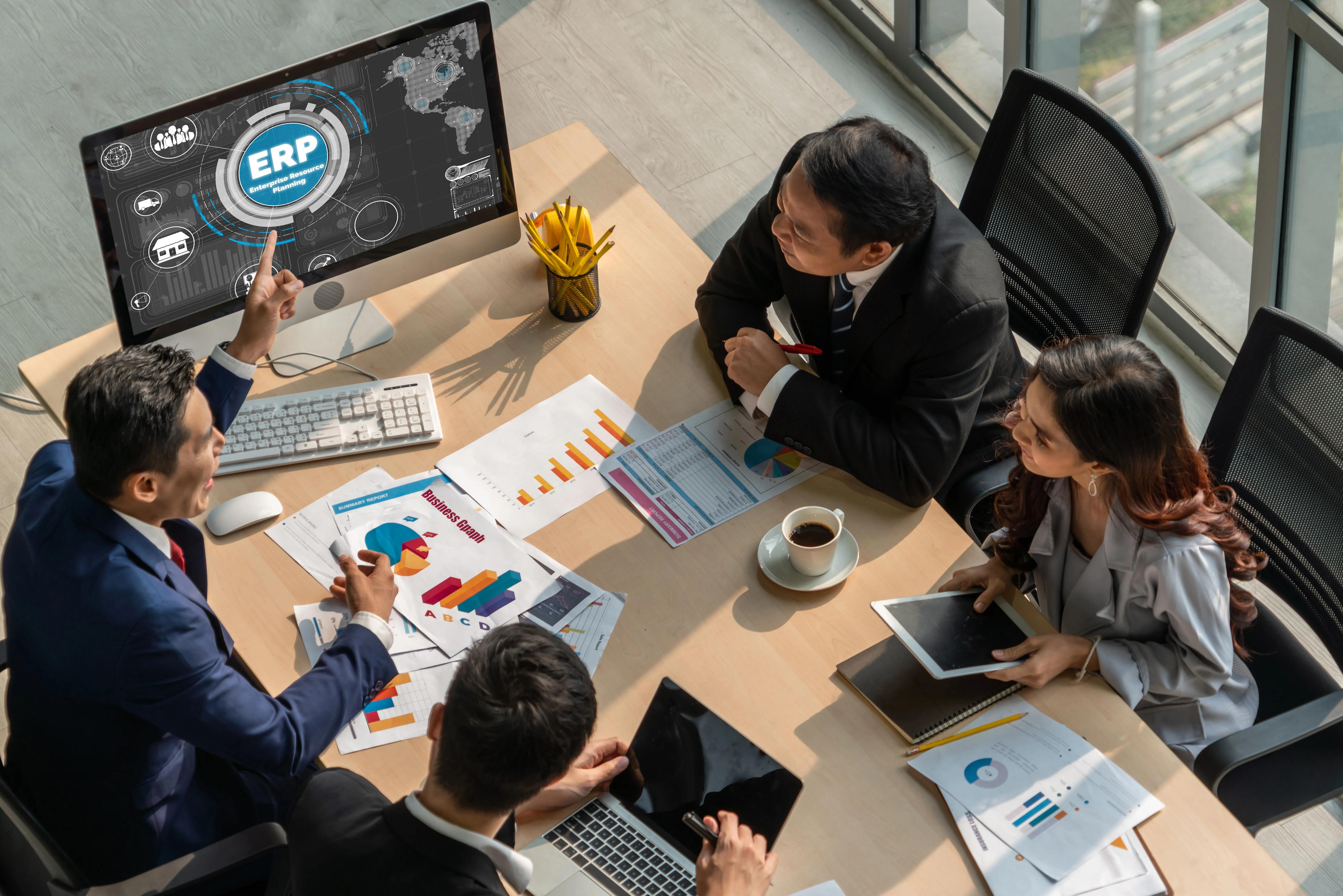 Business team reviewing software dashboards